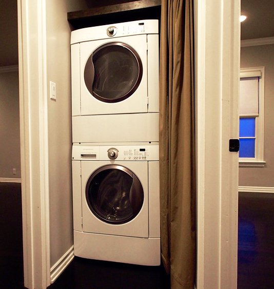 Every apartment has a washer and dryer in the hallway